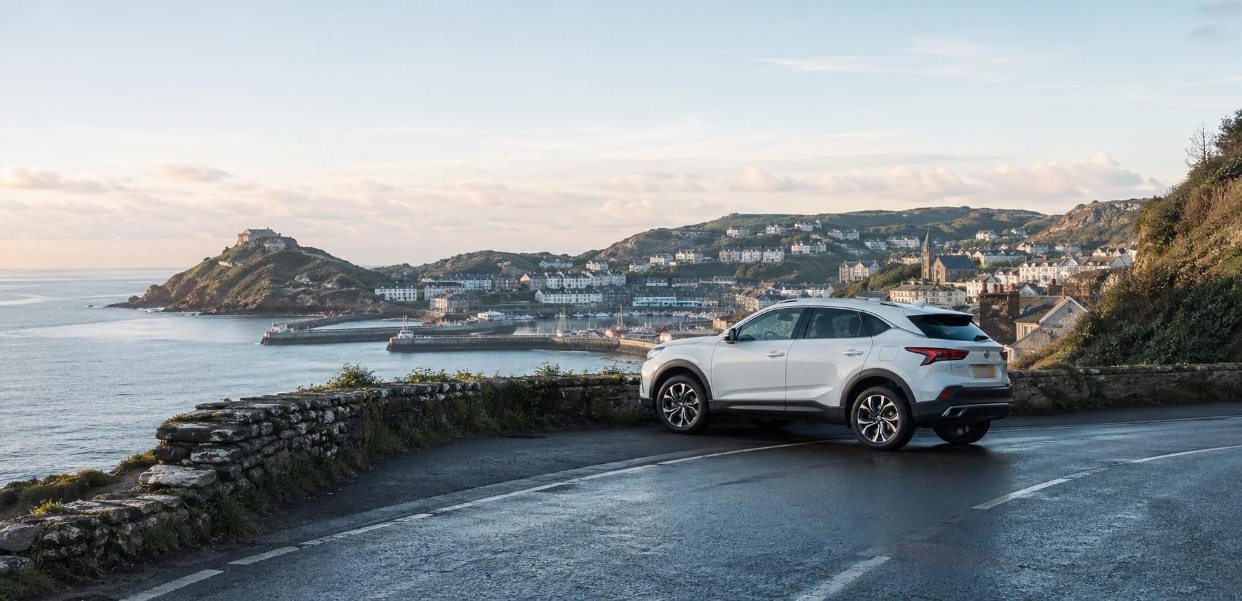 White crossover at a scenic roadside viewpoint above Ilfracombe and the sea